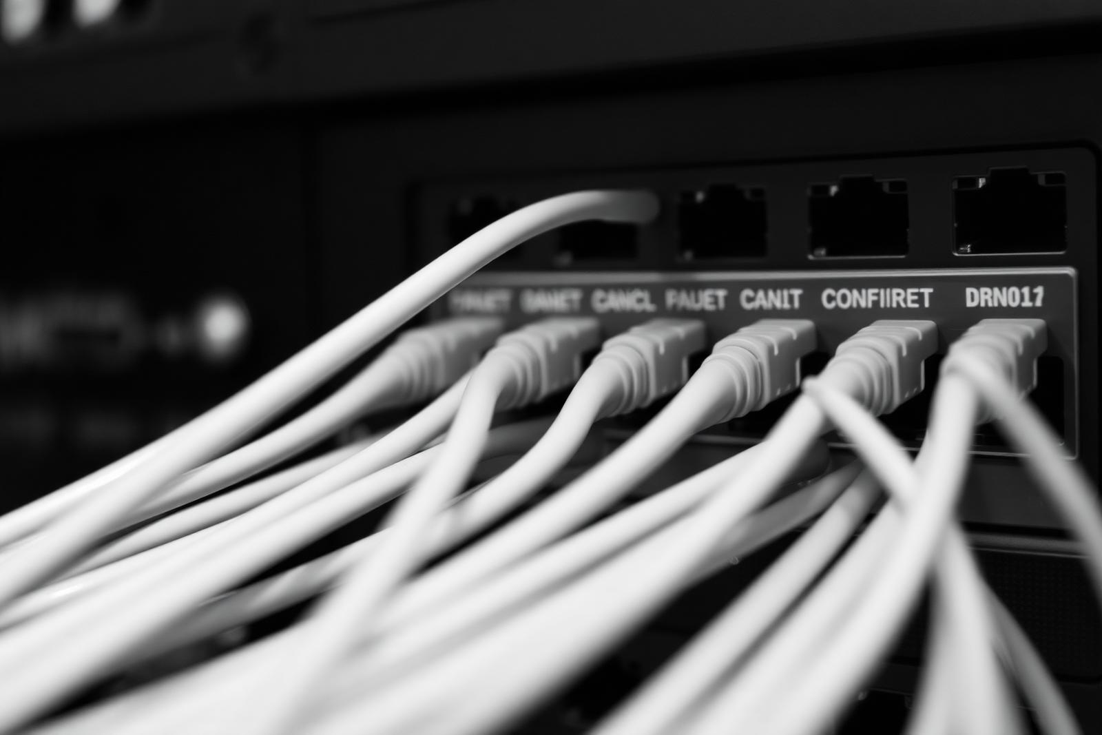 Close view of network patch panel ports with structured cabling
